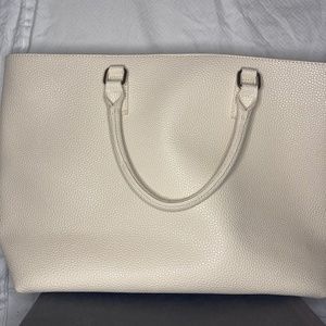justFab cream colored travel bag